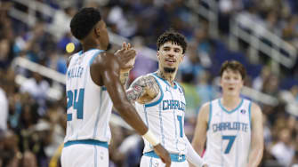 Oct 15, 2025; Greensboro, North Carolina, USA; Charlotte Hornets guard LaMelo Ball (1) celebrates with forward Brandon Miller (24) during the second half against the Memphis Grizzlies at First Horizon Coliseum. Mandatory Credit: Brian Westerholt-Imagn Images