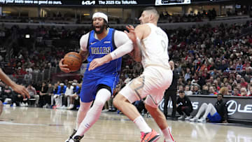 Mar 29, 2025; Chicago, Illinois, USA; Chicago Bulls center Nikola Vucevic (9) defends Dallas Mavericks forward Anthony Davis (3) during the second half at United Center. Mandatory Credit: David Banks-Imagn Images