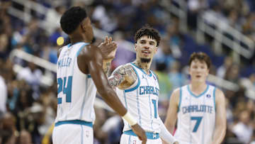 Oct 15, 2025; Greensboro, North Carolina, USA; Charlotte Hornets guard LaMelo Ball (1) celebrates with forward Brandon Miller (24) during the second half against the Memphis Grizzlies at First Horizon Coliseum. Mandatory Credit: Brian Westerholt-Imagn Images