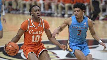 Feb 19, 2025; Tallahassee, Florida, USA; Miami Hurricanes guard Paul Djobet (10) drives past Florida State Seminoles guard Bostyn Holt (3) during the first half at Donald L. Tucker Center. Mandatory Credit: Melina Myers-Imagn Images