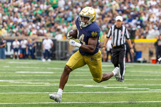 Notre Dame Fighting Irish running back Jadarian Price runs the ball against the Purdue Boilermakers.