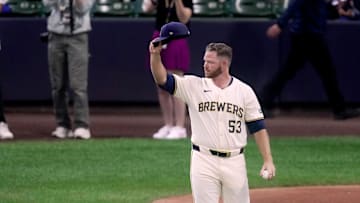 Injured Milwaukee Brewers pitcher Brandon Woodruff acknowledges the cheers of fans as heads out to throw the ceremonial first pitch before their wild-card playoff game against the New York Mets Tuesday, October 1, 2024, at American Family Field in Milwaukee, Wis.