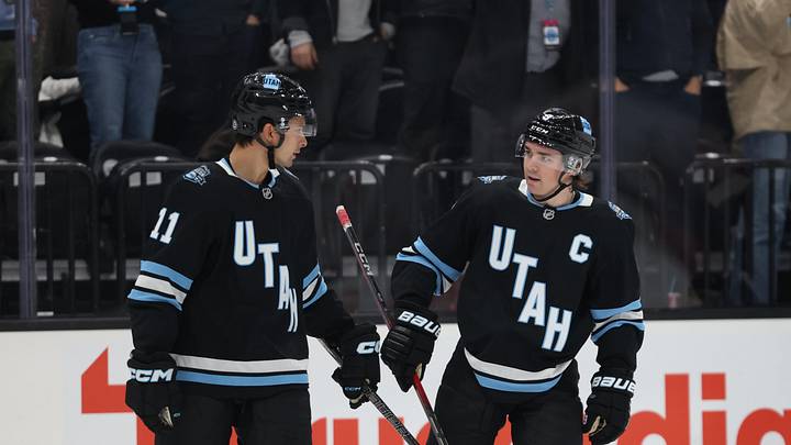 Feb 27, 2025; Salt Lake City, Utah, USA; Utah Hockey Club right wing Dylan Guenther (11) and center Clayton Keller (9) reacts to a goal against the Minnesota Wild during the first period at Delta Center. Mandatory Credit: Rob Gray-Imagn Images