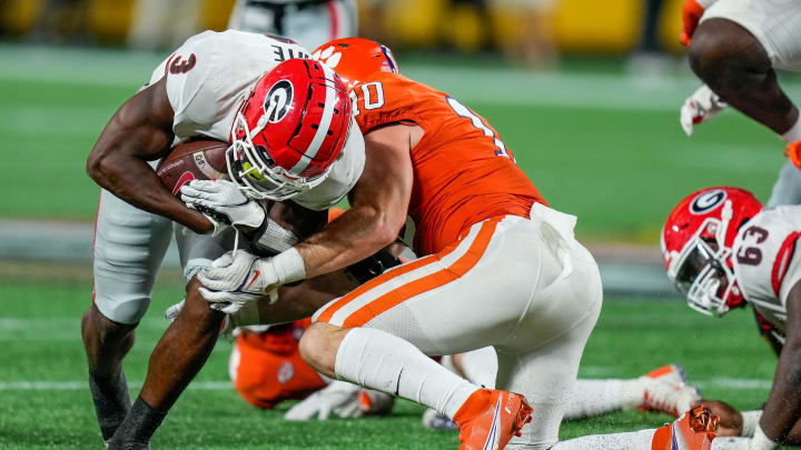 Sep 4, 2021; Charlotte, North Carolina, USA; Georgia Bulldogs running back Zamir White (3) is tackled by Clemson Tigers linebacker Baylon Spector (10) during the second half at Bank of America Stadium. Mandatory Credit: Jim Dedmon-USA TODAY Sports