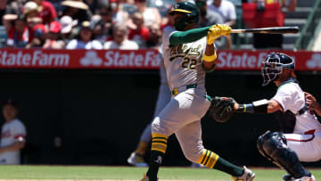 Jul 28, 2024; Anaheim, California, USA;  Oakland Athletics left fielder Miguel Andujar (22) hits an RBI fielder's choice during the third inning against the Los Angeles Angels at Angel Stadium.
