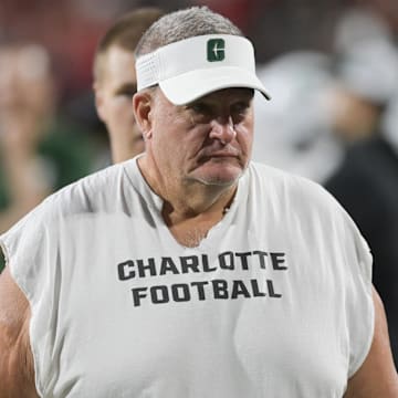 Charlotte 49ers head coach Biff Poggi walks the sidelines against the Maryland Terrapins at SECU Stadium. 