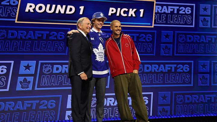 Jun 26, 2026; Buffalo, New York, USA; Gavin McKenna poses with NHL commissioner Gary Bettman and singer Justin Bieber after being selected with the first pick in the first round of the 2026 NHL Draft by the Toronto Maple Leafs at KeyBank Center. Mandatory Credit: Timothy T. Ludwig-Imagn Images