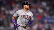 Jun 3, 2025; Atlanta, Georgia, USA; Arizona Diamondbacks catcher Gabriel Moreno (14) hits a single against the Atlanta Braves in the ninth inning at Truist Park. Mandatory Credit: Brett Davis-Imagn Images
