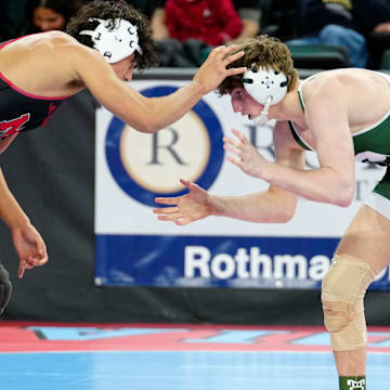 Carl Betz (right) , of Delbarton, is shown against Rober Barrezueta, of Morris Hills, in a 157 pound match, during the opening round of the NJSIAA Wrestling State Championships, Thursday, February 29, 2024, in Atlantic City. Betz would go on to win the match.