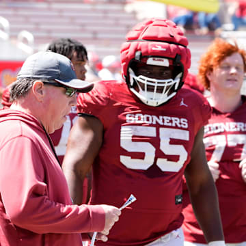 Oklahoma Offensive Line coach Bill Bedenbaugh, linemen Michael Fasusi and Eddy Pierre-Louis