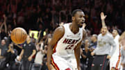 Nov 10, 2025; Miami, Florida, USA;  Miami Heat forward Andrew Wiggins (22) reacts after he dunks to win the game against the Cleveland Cavaliers during overtime at Kaseya Center. Mandatory Credit: Rhona Wise-Imagn Images