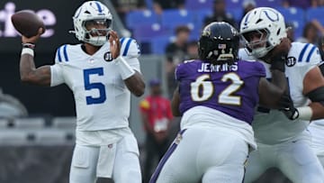 Aug 7, 2025; Baltimore, Maryland, USA; Indianapolis Colts quarterback Anthony Richardson Sr. (5) looks to pass during the first quarter pressured by Baltimore Ravens nose tackle John Jenkins (62) at M&T Bank Stadium. Mandatory Credit: Mitch Stringer-Imagn Images