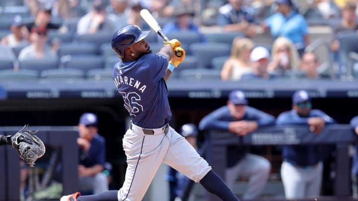 Jul 20, 2024; Bronx, New York, USA; Tampa Bay Rays left fielder Randy Arozarena (56) follows through on a two run home run against the New York Yankees during the seventh inning at Yankee Stadium. Mandatory Credit: Brad Penner-USA TODAY Sports