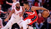 Nov 12, 2025; Houston, Texas, USA; Washington Wizards guard CJ McCollum (3) handles the ball against Houston Rockets guard Josh Okogie (20) during the first quarter at Toyota Center. Mandatory Credit: Erik Williams-Imagn Images