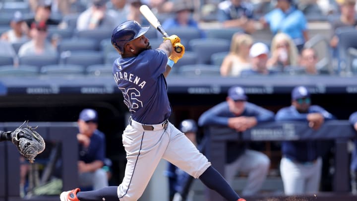 Jul 20, 2024; Bronx, New York, USA; Tampa Bay Rays left fielder Randy Arozarena (56) follows through on a two run home run against the New York Yankees during the seventh inning at Yankee Stadium. Mandatory Credit: Brad Penner-USA TODAY Sports