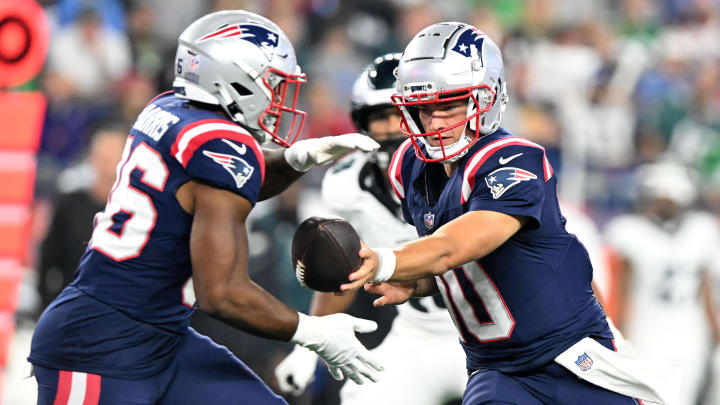 Aug 15, 2024; Foxborough, Massachusetts, USA; New England Patriots quarterback Drake Maye (10) hands the ball off to running back Kevin Harris (36) during the second half at Gillette Stadium. Mandatory Credit: Brian Fluharty-USA TODAY Sports