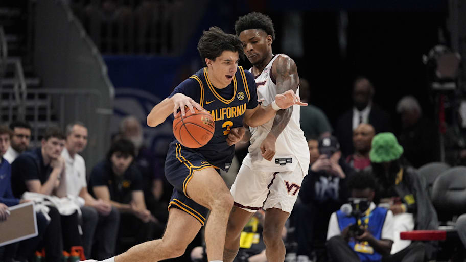 Cal guard Andrej Stojakovic drives to the basket against Virginia Tech guard Jaydon Young.