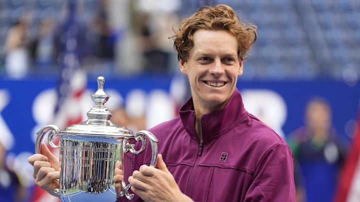 Sep 8, 2024; Flushing, NY, USA; Jannik Sinner (ITA) celebrates with the trophy after defeating Taylor Fritz (USA) in the men’s singles final of the 2024 U.S. Open tennis tournament at USTA Billie Jean King National Tennis Center. Mandatory Credit: Robert Deutsch-Imagn Images