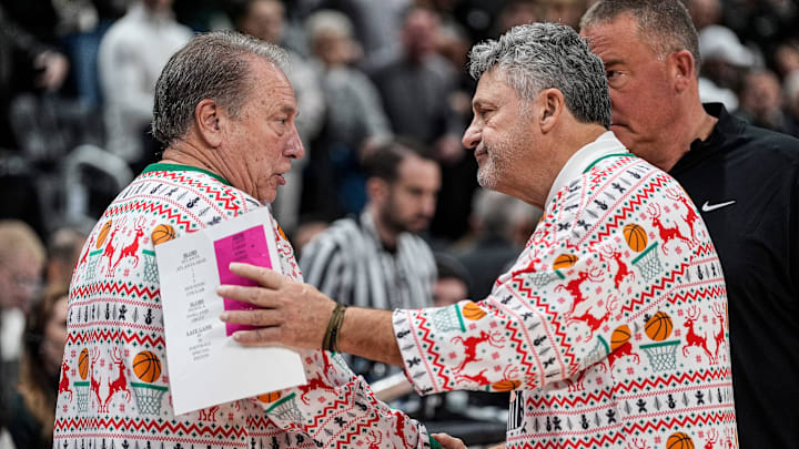 Michigan State head coach Tom Izzo, left, shakes hands with Oakland head coach Greg Kampe after 79-70 win at Little Caesars Arena in Detroit on Saturday, Dec. 20, 2025.