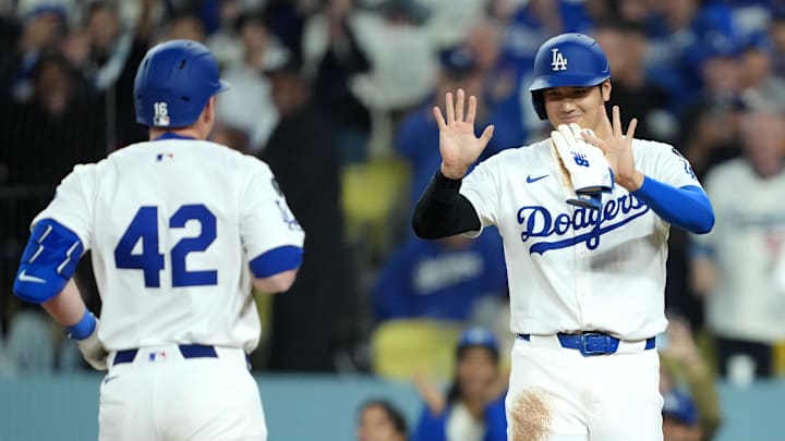 Dodgers catcher Will Smith (16) celebrates with designated hitter Shohei Ohtani (17) after hitting a three run home run in the third inning against the Colorado Rockies at Dodger Stadium on April 15.