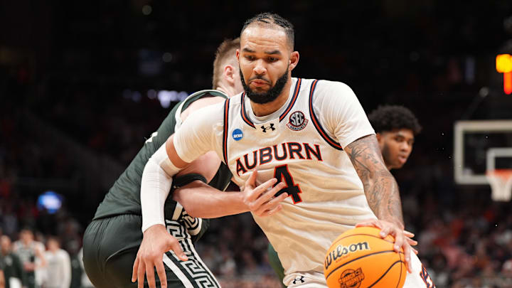 Mar 30, 2025; Atlanta, GA, USA; Auburn Tigers forward Johni Broome (4) drives against Michigan State Spartans forward Jaxon Kohler (0) during the second half in the South Regional final of the 2025 NCAA tournament at State Farm Arena. Mandatory Credit: Dale Zanine-Imagn Images