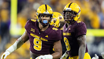 Nov 28, 2025; Tempe, Arizona, USA; Arizona State Sun Devils defensive lineman Elijah O'Neal (9) and linebacker Jordan Crook (8) against the Arizona Wildcats during the 99th Territorial Cup at Mountain America Stadium. Mandatory Credit: Mark J. Rebilas-Imagn Images