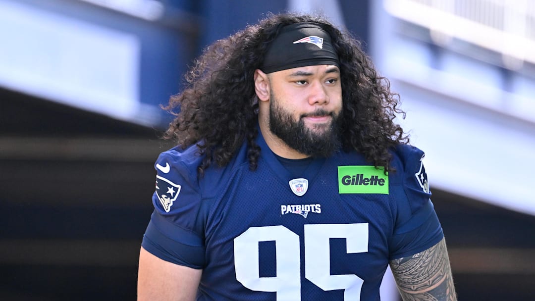 Jul 23, 2025; Foxborough, MA, USA; New England Patriots defensive tackle Khyiris Tonga (95)  walks to the practice field for training camp at Gillette Stadium. Mandatory Credit: Eric Canha-Imagn Images