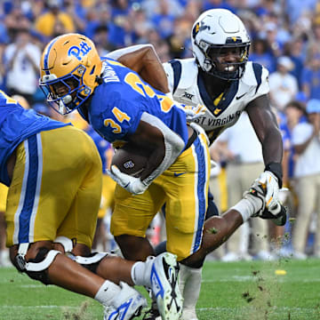 Sep 14, 2024; Pittsburgh, Pennsylvania, USA; Pittsburgh Panthers running back Derrick Davis Jr. (34) scores a touchdown against the West Virginia Mountaineers during the fourth quarter at Acrisure Stadium. Mandatory Credit: Barry Reeger-Image Images