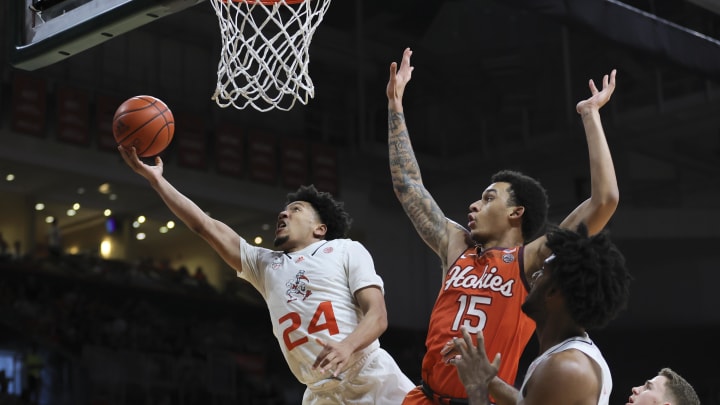 Feb 3, 2024; Coral Gables, Florida, USA; Miami Hurricanes guard Nijel Pack (24) drives to the basket past Virginia Tech Hokies center Lynn Kidd (15) during the second half at Watsco Center. Mandatory Credit: Sam Navarro-USA TODAY Sports