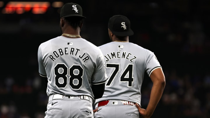 Jul 25, 2024; Arlington, Texas, USA; Chicago White Sox center fielder Luis Robert Jr. (88) and designated hitter Eloy Jimenez (74) warm up before a game against the Texas Rangers at Globe Life Field.