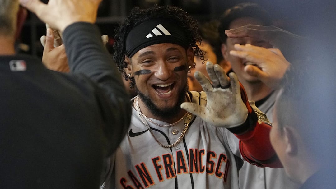 Aug 22, 2025; Milwaukee, Wisconsin, USA; San Francisco Giants outfielder Luis Matos (29) celebrates in the dug out after hitting a home run against the Milwaukee Brewers in the second inning at American Family Field. Mandatory Credit: Michael McLoone-Imagn Images