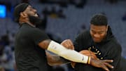 Dec 25, 2024; San Francisco, California, USA; Los Angeles Lakers forward LeBron James (left) jokes with forward Rui Hachimura (right) before the game against the Golden State Warriors at Chase Center. Mandatory Credit: Darren Yamashita-Imagn Images
