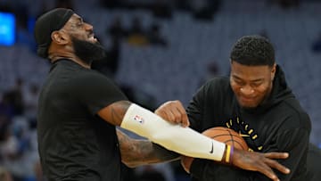 Dec 25, 2024; San Francisco, California, USA; Los Angeles Lakers forward LeBron James (left) jokes with forward Rui Hachimura (right) before the game against the Golden State Warriors at Chase Center. Mandatory Credit: Darren Yamashita-Imagn Images