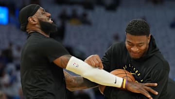 Dec 25, 2024; San Francisco, California, USA; Los Angeles Lakers forward LeBron James (left) jokes with forward Rui Hachimura (right) before the game against the Golden State Warriors at Chase Center. Mandatory Credit: Darren Yamashita-Imagn Images