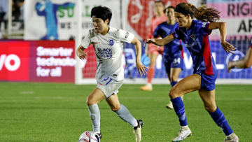 Apr 27, 2024; Cary, North Carolina, USA; Seattle Reign FC midfielder Ji So-Yun (91) moves the ball against North Carolina Courage midfielder Landy Mertz (19) at WakeMed Soccer Park. Mandatory Credit: Jaylynn Nash-USA TODAY Sports