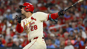 Sep 20, 2025; St. Louis, Missouri, USA; St. Louis Cardinals third baseman Nolan Arenado (28) hits a one run single against the Milwaukee Brewers during the fourth inning at Busch Stadium.