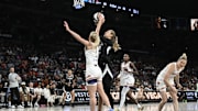 Jun 15, 2025; Las Vegas, Nevada, USA; Phoenix Mercury guard Lexi Held (1) blocks a shot by Las Vegas Aces center Elizabeth Kitley (33) in the third quarter at Michelob Ultra Arena. Mandatory Credit: Candice Ward-Imagn Images