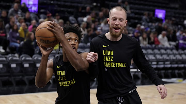 Feb 4, 2024; Salt Lake City, Utah, USA;  Utah Jazz guard Collin Sexton (2) warms up with Duke basketball assistant coach Evan Bradds before the game against the Milwaukee Bucks at Delta Center.