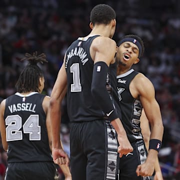 Dec 11, 2023; Houston, Texas, USA; San Antonio Spurs center Victor Wembanyama (1) celebrates with forward Keldon Johnson (3) after scoring a basket during the third quarter against the Houston Rockets at Toyota Center.