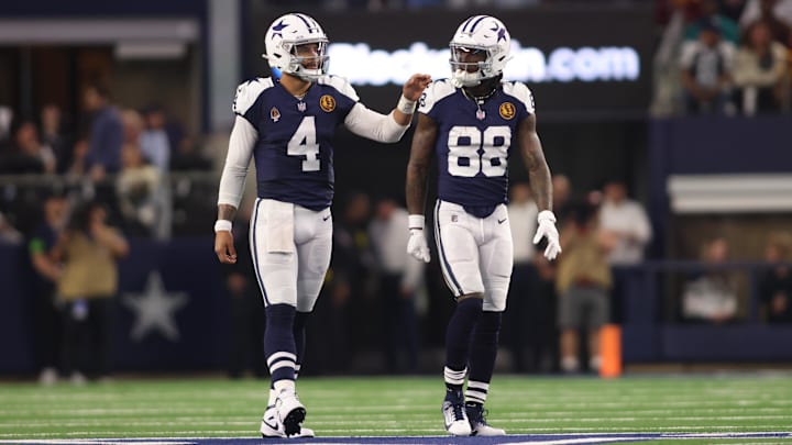 Dallas Cowboys WR CeeDee Lamb and QB Dak Prescott talk during the game against the Washington Commanders. Dallas Cowboys WR CeeDee Lamb and QB Dak Prescott talk during the game against the Washington Commanders.