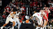 Cincinnati Bearcats guard Jizzle James (2) grabs a loose ball in the first half of a NCAA men’s basketball game between the Cincinnati Bearcats and Utah Utes, Tuesday, Feb. 11, 2025, at Fifth Third Arena in Cincinnati.