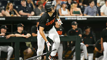 Jun 13, 2025; Omaha, Neb, USA; Oregon State Beavers shortstop Aiva Arquette (13) singles against the Louisville Cardinals during the ninth inning at Charles Schwab Field. Mandatory Credit: Steven Branscombe-Imagn Images