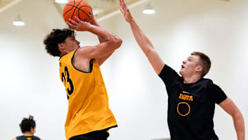 Iowa’s Isaia Howard (23) shoots as Bennett Stirtz (14) defends during practice June 19, 2025 at Carver-Hawkeye Arena in Iowa City, Iowa.