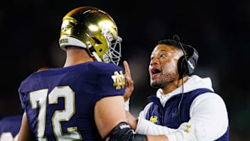 Notre Dame head coach Marcus Freeman coaches offensive lineman Sam Pendleton (72) after Pendleton received an unsportsmanlike conduct penalty during a NCAA college football game against Florida State at Notre Dame Stadium on Saturday, Nov. 9, 2024, in South Bend.