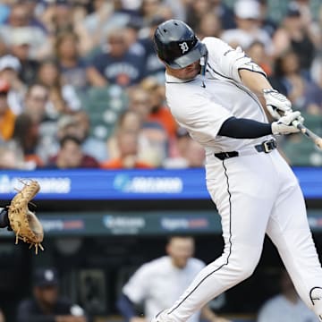 Jul 9, 2025; Detroit, Michigan, USA;  Detroit Tigers first baseman Spencer Torkelson (20) hits an RBI single in the fourth inning against the Tampa Bay Rays at Comerica Park. Mandatory Credit: Rick Osentoski-Imagn Images