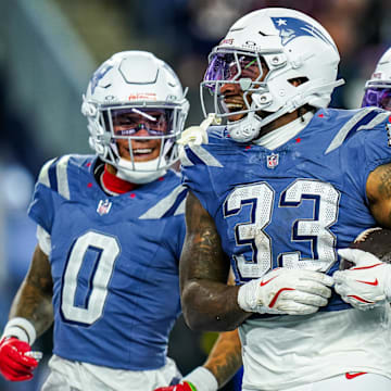 Nov 13, 2025; Foxborough, Massachusetts, USA; New England Patriots linebacker Anfernee Jennings (33) retrieves the ball after a bad snap by the New York Jets in the fourth quarter at Gillette Stadium. Mandatory Credit: David Butler II-Imagn Images