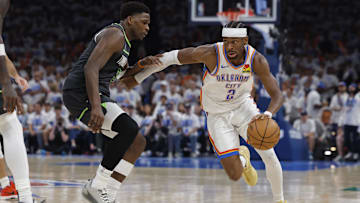 Oklahoma City Thunder guard Shai Gilgeous-Alexander drives against Minnesota Timberwolves guard Anthony Edward in the fourth quarter during game one of the western conference finals for the 2025 NBA Playoffs at Paycom Center. 