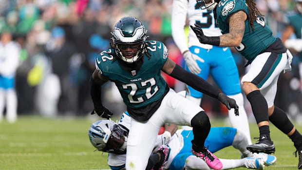 Philadelphia Eagles cornerback Kelee Ringo (22) tackles Carolina Panthers running back Raheem Blackshear.