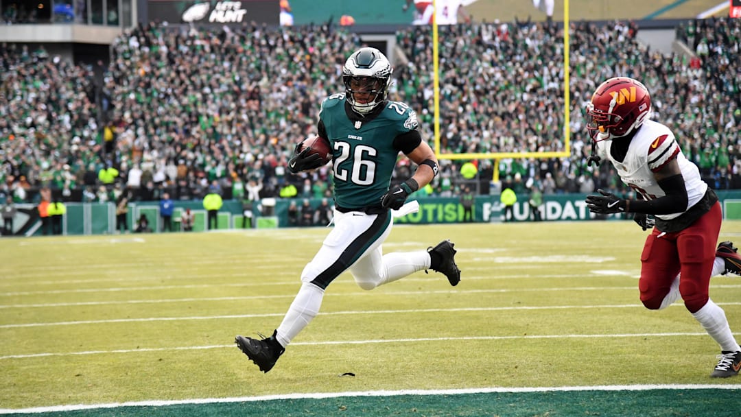 Jan 26, 2025; Philadelphia, PA, USA; Philadelphia Eagles running back Saquon Barkley (26) runs with the ball for a touchdown against the Washington Commanders during the first half in the NFC Championship game at Lincoln Financial Field. Mandatory Credit: Eric Hartline-Imagn Images