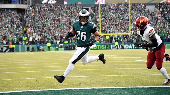 Jan 26, 2025; Philadelphia, PA, USA; Philadelphia Eagles running back Saquon Barkley (26) runs with the ball for a touchdown against the Washington Commanders during the first half in the NFC Championship game at Lincoln Financial Field. Jan 26, 2025; Philadelphia, PA, USA; Philadelphia Eagles running back Saquon Barkley (26) runs with the ball for a touchdown against the Washington Commanders during the first half in the NFC Championship game at Lincoln Financial Field.